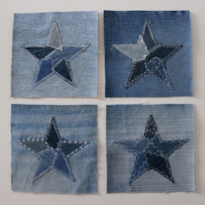 May include: Four denim squares with a patchwork star design in the centre of each. The stars are made of different shades of blue denim.