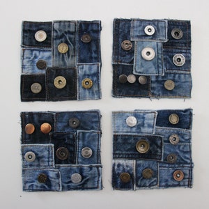 May include: Four square denim coasters featuring assorted coloured buttons and rivets. The coasters are crafted from recycled denim and offer a rustic charm to your home decor.
