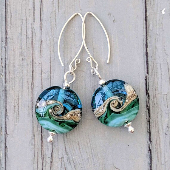 Earrings with small dark blue sea glass beads