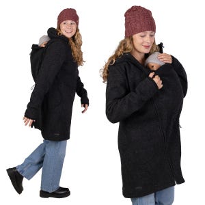 May include: A dark gray hooded coat with a baby carrier insert. The coat has a zipper closure and a drawstring hood. The person in the image is wearing a burgundy knit cap and blue jeans. The coat is designed to accommodate a baby.