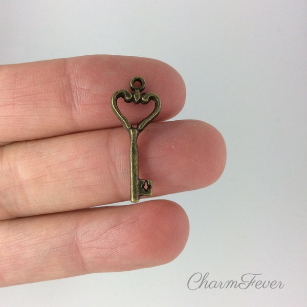 15 Key Charms- 26x10 mm - Antique Bronze Tone- Double Sided Charm-  Ref. 686