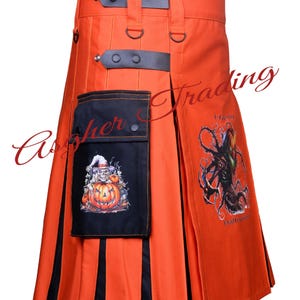 May include: Orange kilt with black stripes and a black utility pocket. The pocket has a printed image of a pumpkin and a character wearing a hat. The kilt has a printed image of a spooky tree and the text "Happy Halloween".