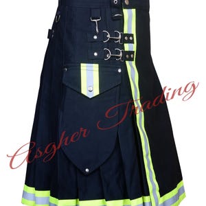 May include: A black utility kilt with reflective yellow and silver trim. The kilt has a large cargo pocket on the front and multiple buckles and straps.
