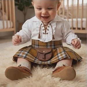 May include: A white long-sleeved shirt with a ruffled collar and brown lace-up detail, paired with a mustard yellow and blue plaid skirt featuring an attached brown leather-like pouch, worn with beige socks and brown leather-like soft-soled shoes.