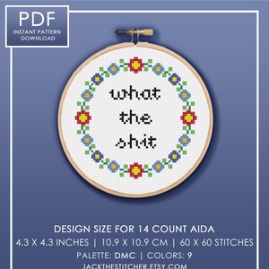 May include: A cross-stitch pattern featuring a floral wreath with the phrase "what the shit" in the center. The pattern is designed for 14 count Aida fabric and measures 4.3 inches by 4.3 inches, or 10.9 cm by 10.9 cm. It uses 9 colors of DMC floss.