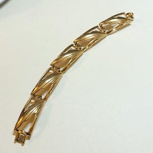 Vintage Monet panel bracelet, 6 1/2 inches, goldtone rectangular links, 1980s-90s  B3296