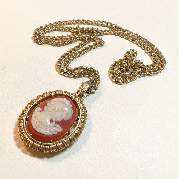 Vintage cameo pendant, two-sided, with 24 inches long, goldtone metal, classic resin cameo with design on reverse side, 1970s  NP432