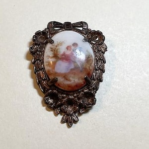Vintage Fragonard style courting couple cameo brooch, dark goldtone metal, white porcelain cabochon, transfer pastoral image, 1970s  PP7129