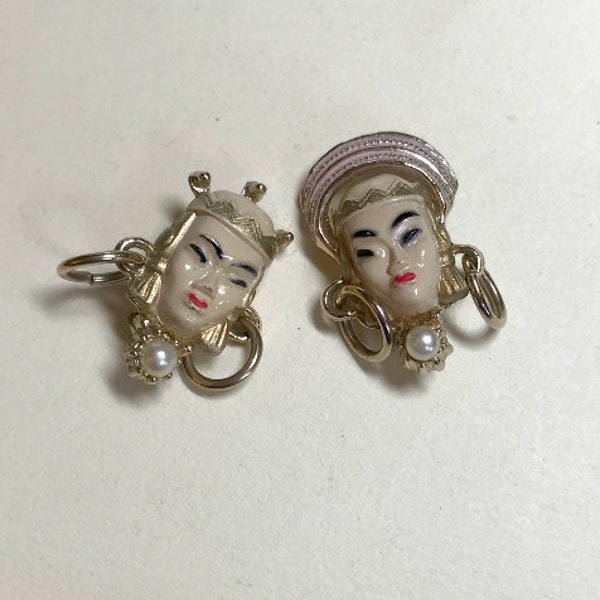 A pair of vintage Selro Selini Asian Thai Princess scatter pins, unmarked, plastic faces, goldtone metal, Selro Selini brooches 1950s-60s