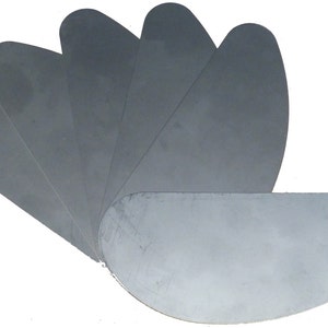 May include: Set of seven gray metal sanding pads, arranged in a fan shape.