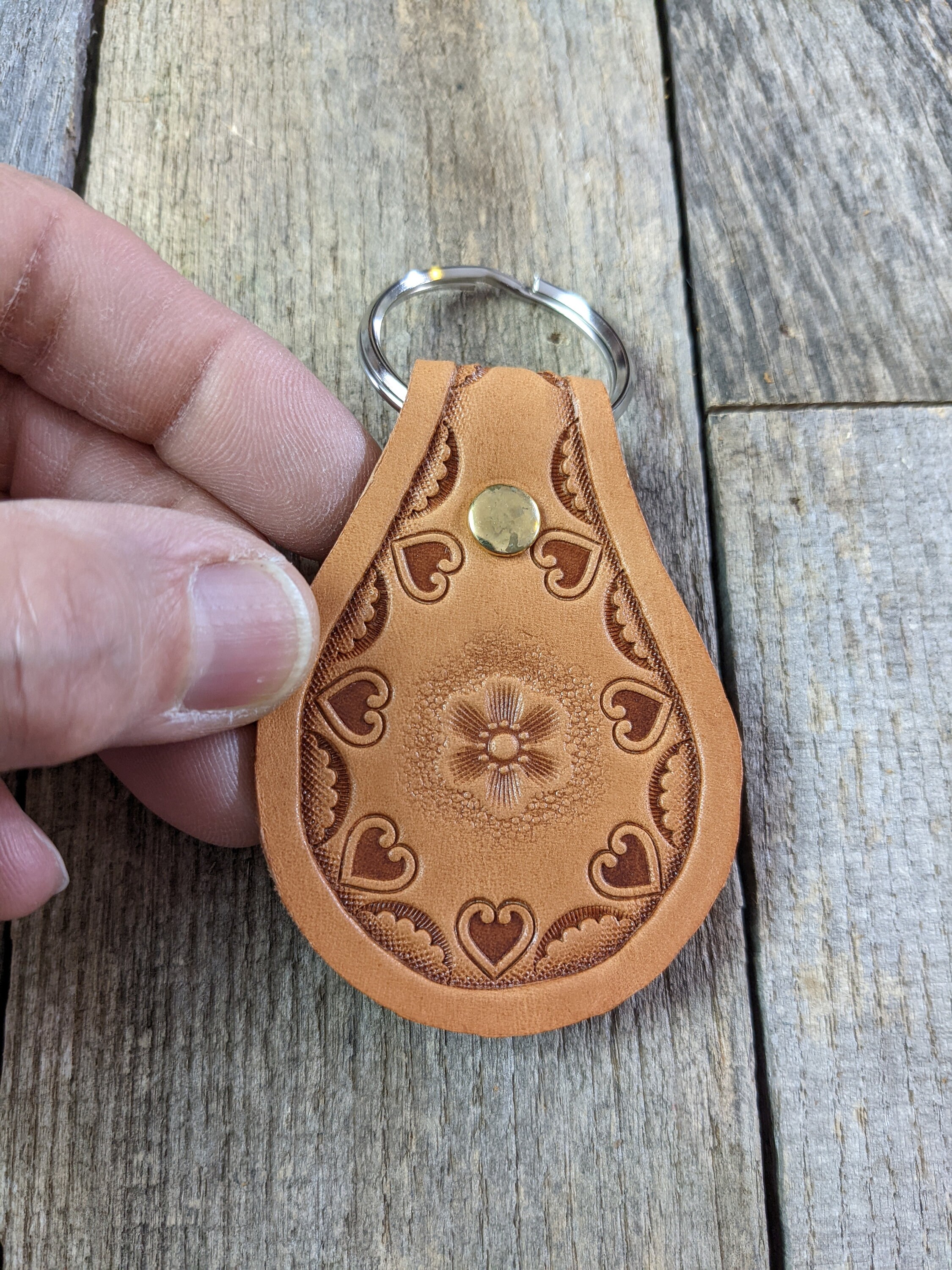 Stamped Leather Keychain with Flower Center and Heart Border Design
