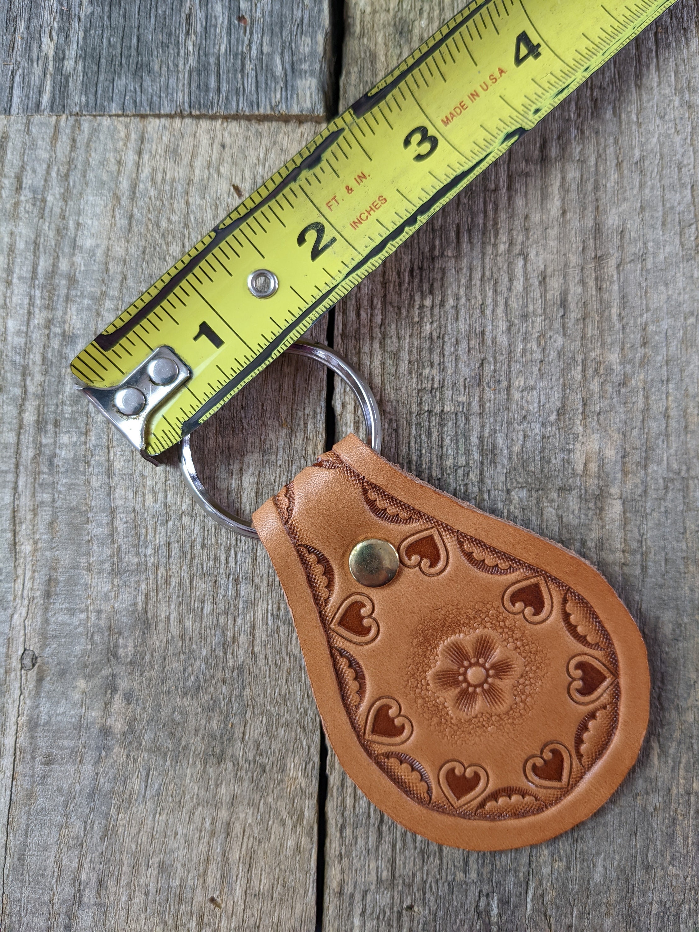 Stamped Leather Keychain with Flower Center and Heart Border Design