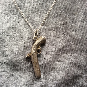 antique revolver necklace