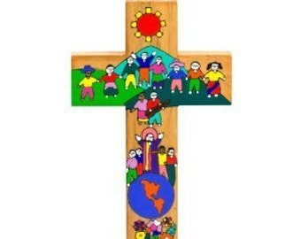 May include: Wooden cross with a painted design featuring figures holding hands, a sun, and a globe. The cross is made of light-colored wood and has a loop for hanging. The figures are depicted in various colors, and the globe shows the continents.