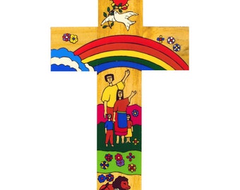 May include: A wooden cross with a rainbow, a family, a dove, a sun, and flowers painted on it. The cross is a religious symbol of hope and faith.