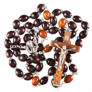 Beautifully hand made set of rosary beads. Brown Wood Beads and strong wire links. Wood and metal crucifix.