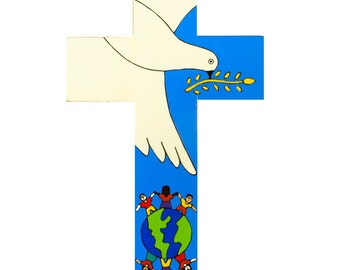 May include: A wooden cross with a blue background. A white dove with a yellow olive branch flies above a globe with children of different races holding hands around it.