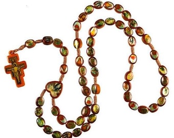 May include: A brown wooden rosary with colorful images of saints and religious figures. The rosary has a crucifix with a figure of Jesus Christ.