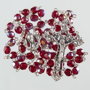 Strong Wire Rosary with Red Garnet Crystal Beads. Ornate Christ Design Corpus on the Crucifix.