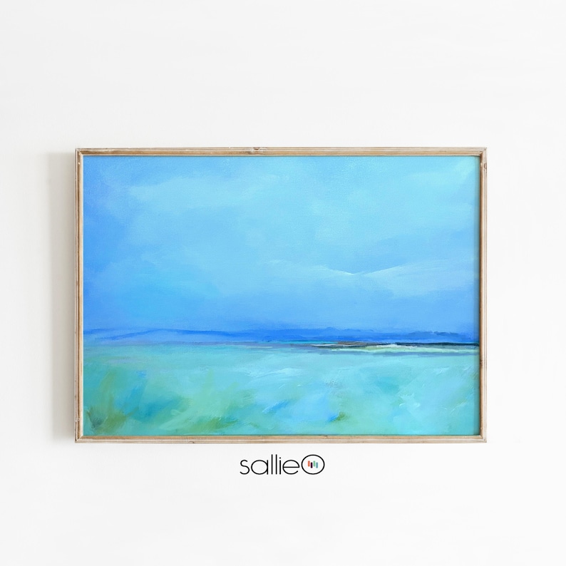 May include: Abstract painting of a seascape with a blue sky and green water. The painting is framed in a light wood frame.
