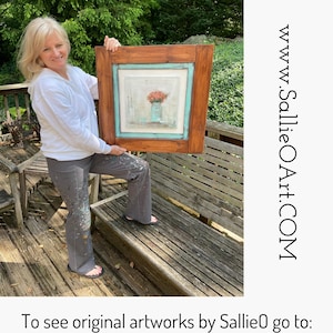 May include: A framed painting featuring a floral still life in a blue vase. The artwork is set within a light blue border and a dark brown wooden frame. The website address www.SallieOArt.com is visible on the right side of the image.