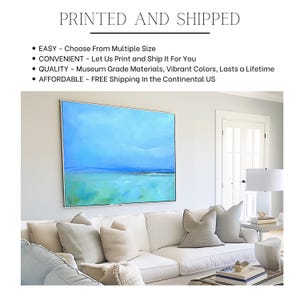 May include: A white couch with pillows in a living room setting. A large abstract painting of a blue and green seascape hangs on the wall above the couch. The text "PRINTED AND SHIPPED" is at the top of the image. The text below the image reads: "EASY - Choose From Multiple Size", "CONVENIENT - Let Us Print and Ship It For You", "QUALITY - Museum Grade Materials, Vibrant Colors, Lasts a Lifetime", "AFFORDABLE - FREE Shipping In the Continental US".