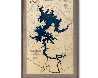 May include: A 3D wooden bathymetric map of Blue Ridge Lake in Fannin County, Georgia, featuring a deep blue water cutout set against a light wood background, enclosed in a driftwood frame with the text 32x20 3D - Driftwood Frame.