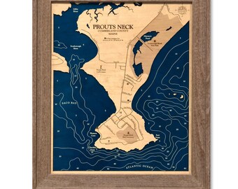 May include: A 16x20 inch 2D wooden bathymetric map of Prouts Neck, Maine, in a driftwood frame. The map features light wood landmasses against deep blue water with depth contours, labeled locations, and the text Prouts Neck, Cumberland County, Maine.