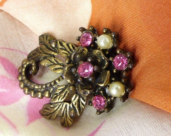 Magnetic brooch pink crystals, faux pearls in antique gold leaf setting. Silk back button. Mag TAK™ Packaged as a gift.