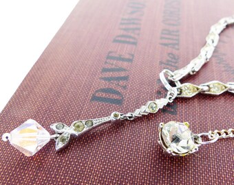 Vintage silver and rhinestone choker necklace with iridescent crystal front dangle and crystal extension dangle chain.