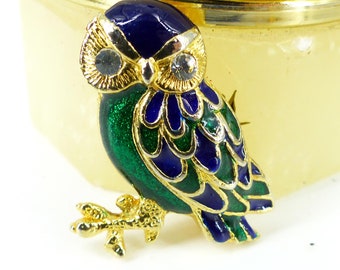 Very detailed blue and green enamel gold wise little owl on branch with clear crystal eyes. Latch back closure. Gift packaged. Heavy feel