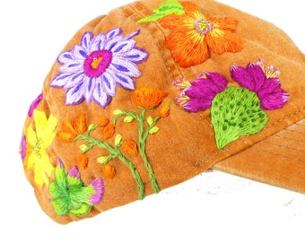 Desert flowers hand embroidered sand washed cotton in apricot, one size fits all buckle adjustment tab. Detail beading,One of a kind design