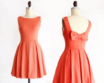 JANUARY | coral bridesmaid dress with bow + pockets. 1960s mod retro vintage style light poppy orange party dress. prom homecoming