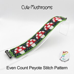 May include: A beaded bracelet with a pattern of red and white mushrooms on a black background. The bracelet is made with even count peyote stitch and has a green border. The bracelet is on a clear display stand. The text "Cute Mushrooms" and "Even Count Peyote Stitch Pattern" is visible in the image.