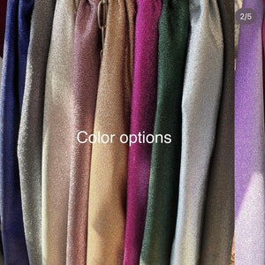 May include: A selection of fabric swatches in various colors, including navy blue, silver, rose gold, gold, purple, green, light blue, gray, and lavender. The swatches are arranged vertically and labeled "Color options".