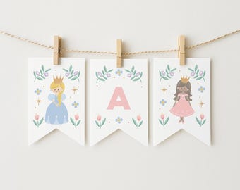 May include: Three white pennant banners hanging from a string with wooden clothespins. Each banner features a princess illustration or the letter "A" in pink. Floral and star accents decorate the top and bottom of each banner.