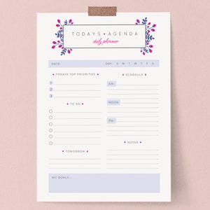 May include: A daily planner sheet with the text "TODAYS AGENDA" and "daily planner" in a decorative frame. The planner includes sections for priorities, schedule, to-do list, and notes, with a "Tomorrow" section and space for goals.