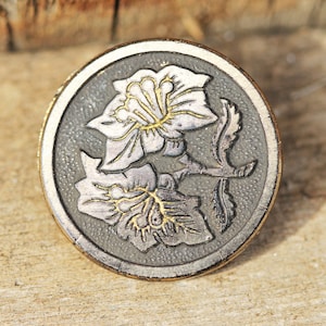 Antique Black Glass Button With Gold Luster and Impressed Flower Design
