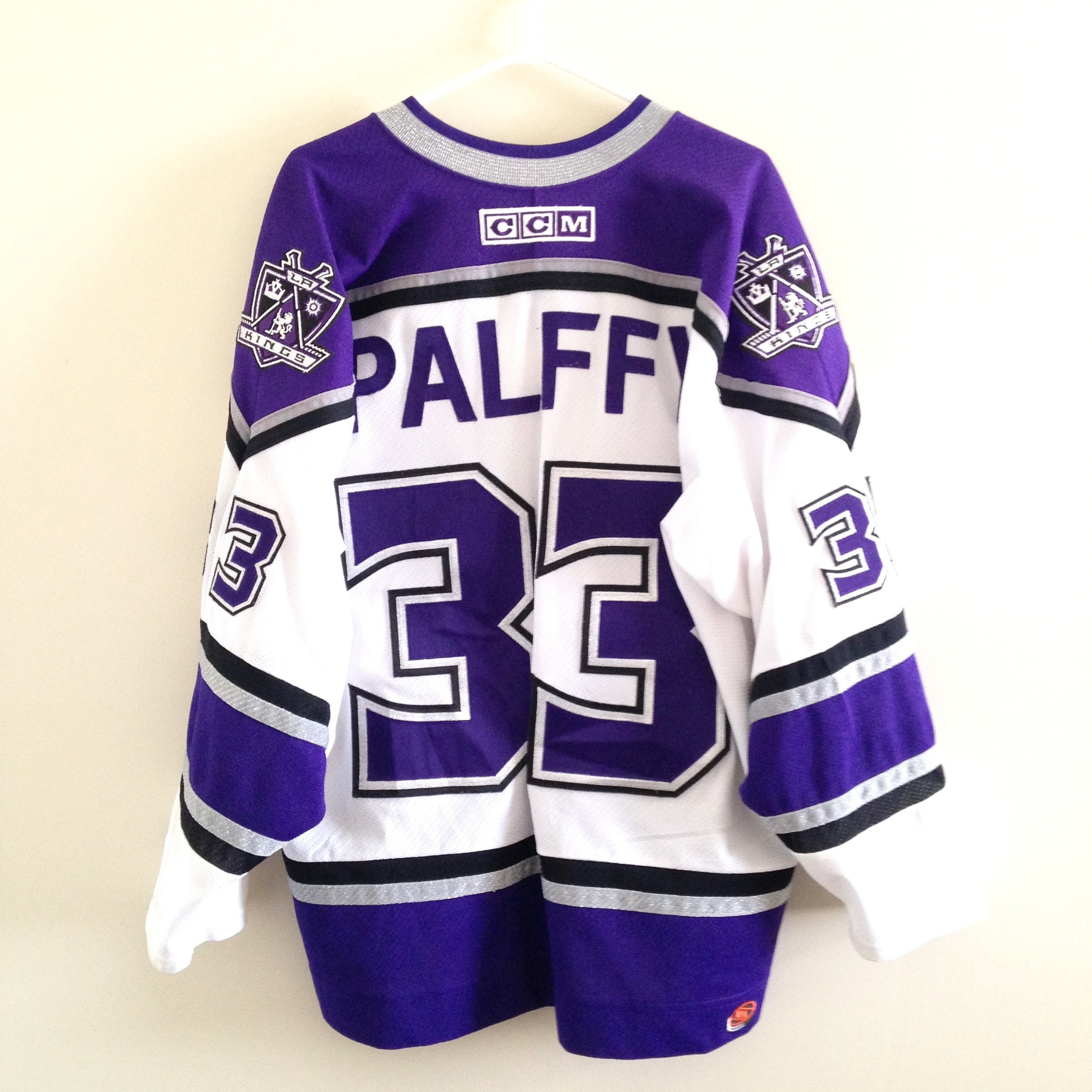 GAME WORN LA KINGS WHITE AND PURPLE JERSEY LEWIS