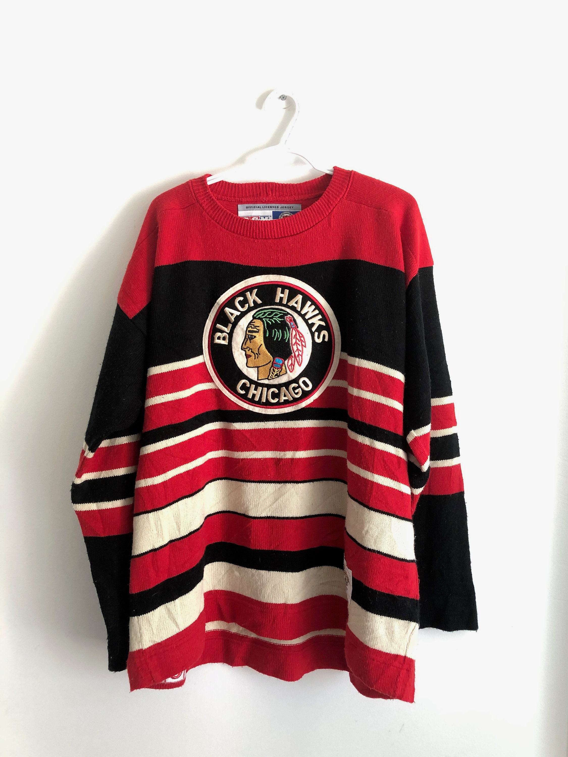HippityHistory Vintage Chicago Blackhawks Hockey Large Jersey. Authentic CCM by Maska Tag. Made in U.S.A. Expected Vintage Age Wear. One Very Slight Stain.