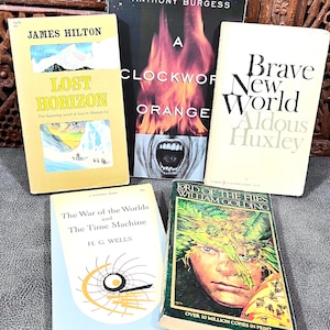 May include: A collection of five classic paperback books including Lost Horizon by James Hilton, A Clockwork Orange by Anthony Burgess, Brave New World by Aldous Huxley, The War of the Worlds and The Time Machine by H.G. Wells, and Lord of the Flies by William Golding.