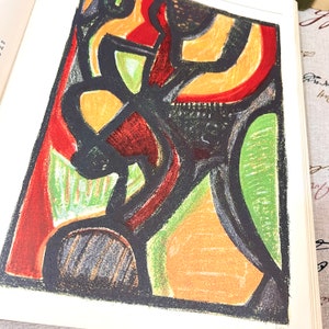 May include: Abstract art print featuring bold black lines outlining shapes filled with vibrant colors. The artwork includes red, orange, yellow, and green hues, creating a dynamic and eye-catching composition. The print is on a white background.