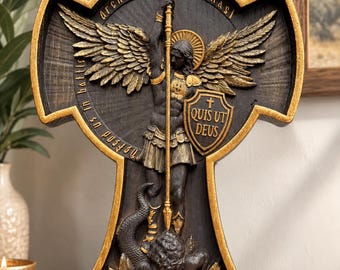May include: A black and gold wall plaque shaped like a cross featuring Archangel Michael holding a sword and a shield with the text "Quis Ut Deus". The figure stands over a serpent, with the text "Defend us in battle" and "Archangel Michael" inscribed.