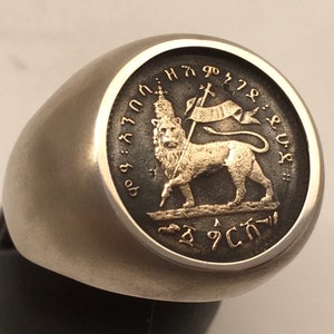 Gold and silver Lion of Judah signet ring: 10K yellow gold coin mounted on a textured vintage style shank. Ethiopian Rasta jewelry