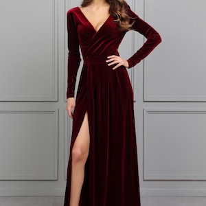 burgundy velvet maxi dress with slit, long sleeve velvet formal gown, fall wedding guest velvet dress, winter burgundy evening gown, elegant velvet bridesmaid dress, modest long sleeve formal dress, velvet gown for holiday party, deep v velvet maxi dress, romantic wedding guest outfit, classy velvet evening dress