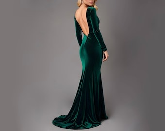 May include: A long-sleeved, emerald green velvet dress with a low back and a fitted silhouette.