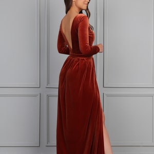 rust velvet maxi dress with slit, long sleeve velvet evening gown, fall wedding guest velvet dress, elegant autumn formal dress, rust color velvet gown, winter evening velvet dress, classic velvet maxi dress women, formal holiday velvet gown, modest long sleeve evening dress, luxury velvet dress fall