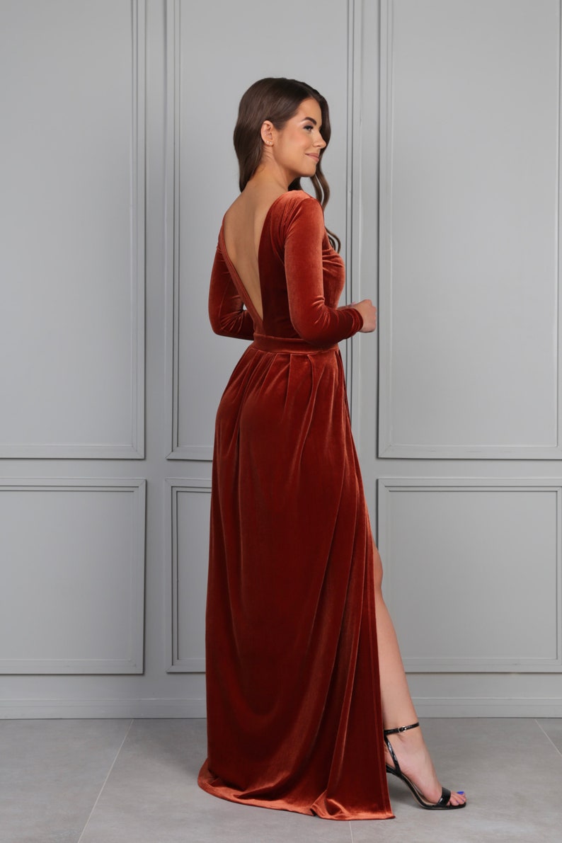 rust velvet maxi dress with slit, long sleeve velvet evening gown, fall wedding guest velvet dress, elegant autumn formal dress, rust color velvet gown, winter evening velvet dress, classic velvet maxi dress women, formal holiday velvet gown, modest long sleeve evening dress, luxury velvet dress fall