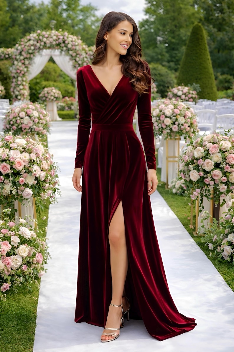 burgundy velvet maxi dress with slit, long sleeve velvet formal gown, fall wedding guest velvet dress, winter burgundy evening gown, elegant velvet bridesmaid dress, modest long sleeve formal dress, velvet gown for holiday party, deep v velvet maxi dress, romantic wedding guest outfit, classy velvet evening dress