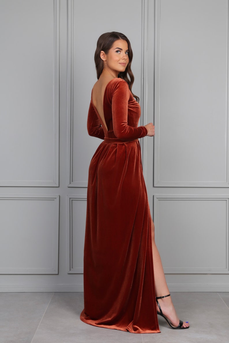 rust velvet maxi dress with slit, long sleeve velvet evening gown, fall wedding guest velvet dress, elegant autumn formal dress, rust color velvet gown, winter evening velvet dress, classic velvet maxi dress women, formal holiday velvet gown, modest long sleeve evening dress, luxury velvet dress fall